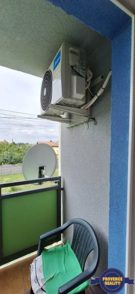 Balcony of a 3-room apartment with air conditioning and satellite, garden view.