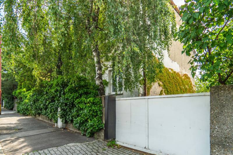 A view of a house surrounded by greenery on Brnianska Street in Bratislava - Staré Mesto.