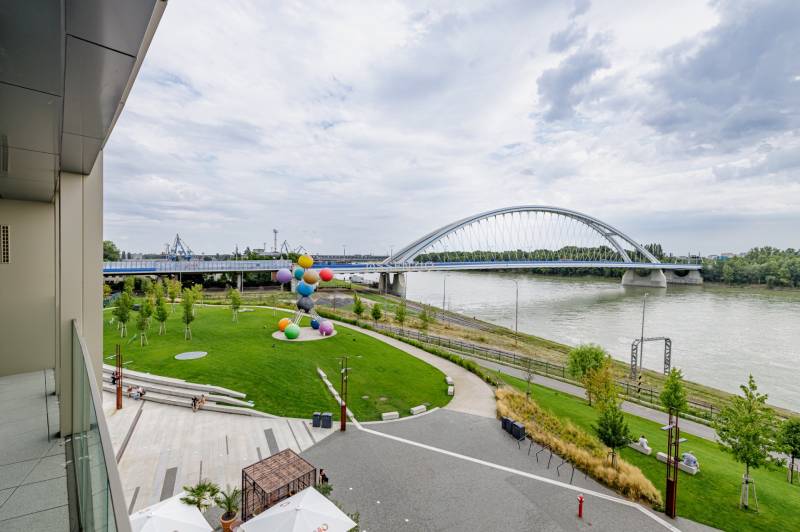 View from the building Bratislava - Staré Mesto to the bridge over the river and colorful sculptures.