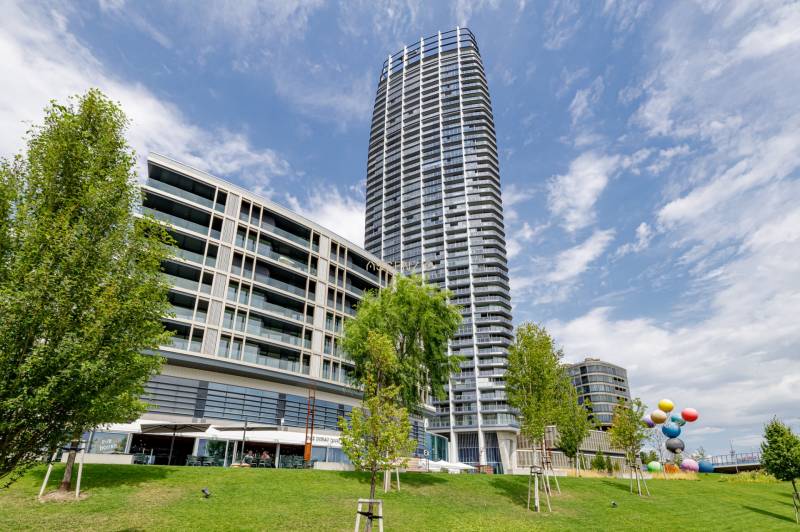 Modern high-rise buildings and greenery in Bratislava - Old Town near three-room apartments.