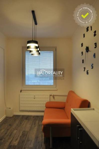 Interior of a 3-room apartment with a wardrobe and geometric wallpaper.