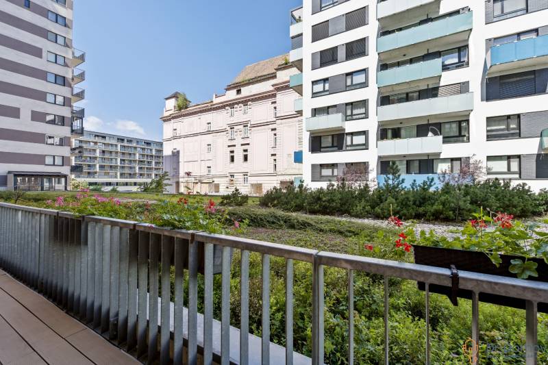 View from the balcony with flowers to the buildings on Jégého Street in Bratislava.