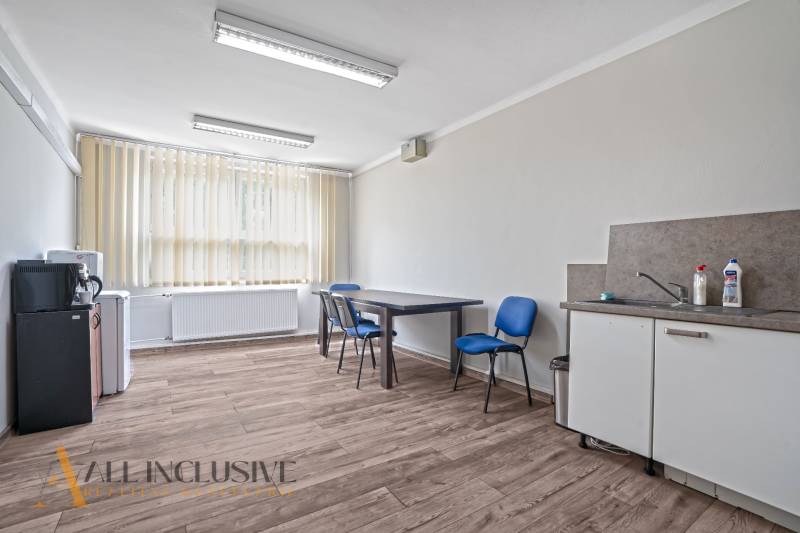 The office equipment includes a desk, chairs, a sink, a faucet, and blinds.