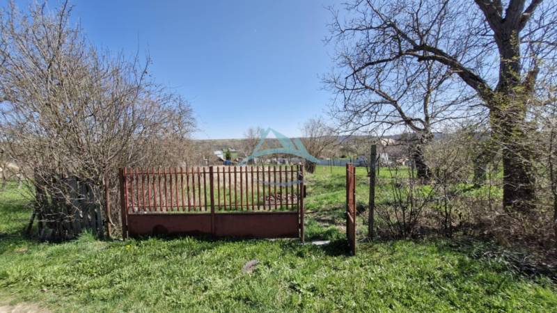 Free residential plots with a gate, surrounded by spring nature and a view of the countryside.