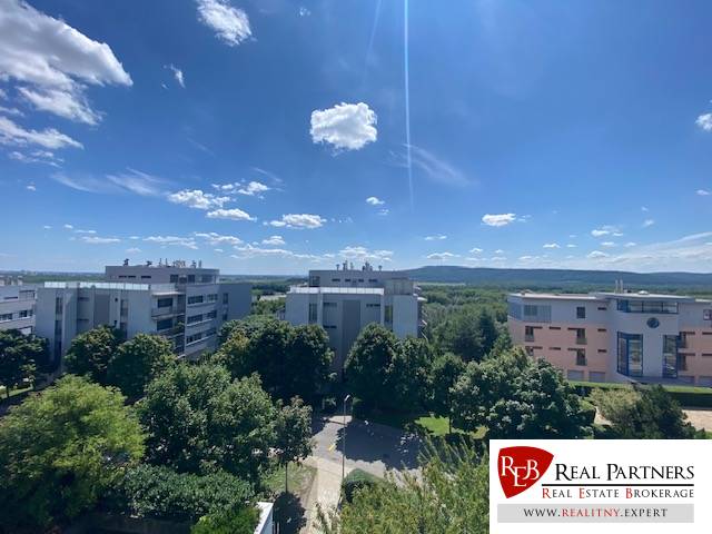 View from a 4-room apartment in Bratislava - Karlova Ves to the surrounding buildings and nature.