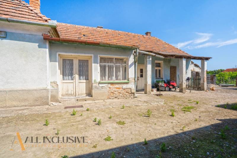 A family house in Jahodná with traditional architecture, two entrances, and a courtyard.