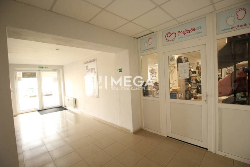 Interior commercial spaces with a glass entrance, the store contains children's products.
