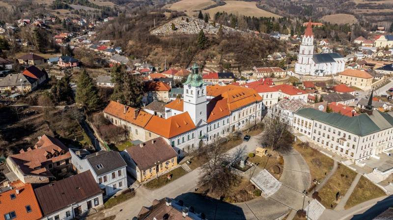Aerial view of the historic part of the town of Gelnica with Banícke Square, hotels, and guesthouses.