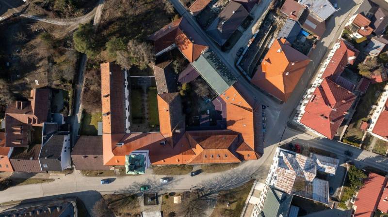 An aerial view of the buildings on Banícke Square in Gelnica. Hotels and guesthouses.