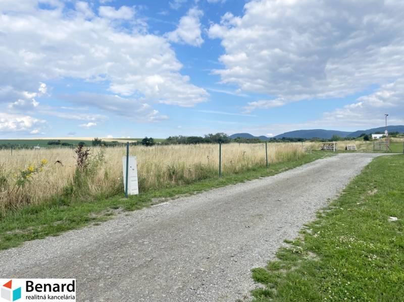 A rural plot on Vodárenská Street in Ľubotice suitable for living, surrounded by nature and fields.