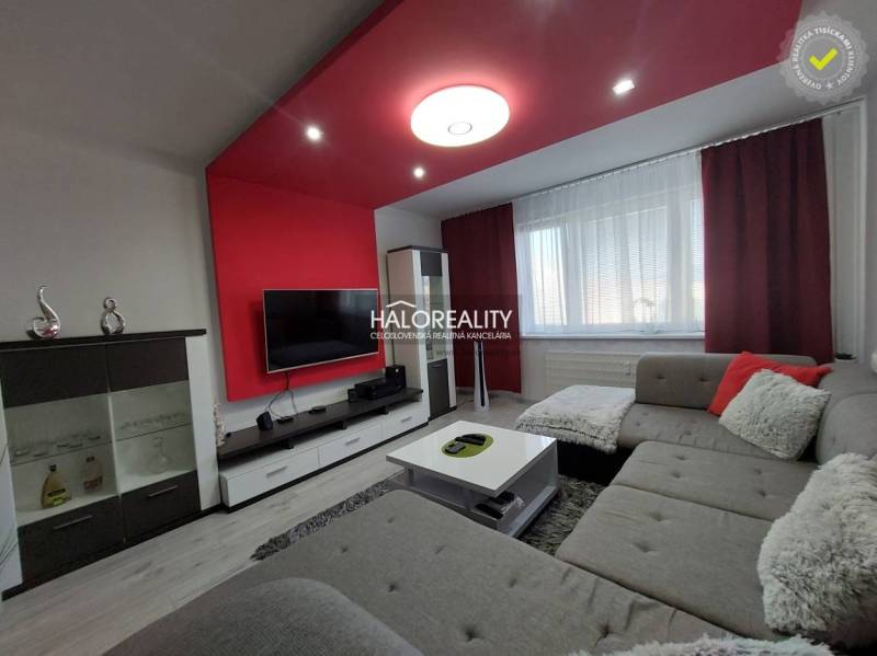 Living room in a 3-room apartment with comfortable seating and a television.