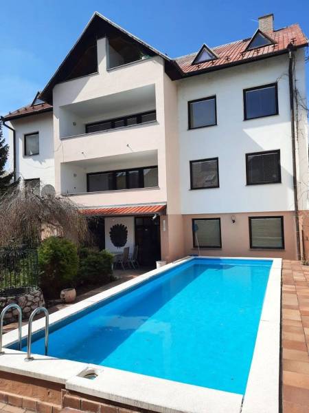 A building with a pool on Pod Párovcami Street in Piešťany, ideal for a 2-bedroom apartment.