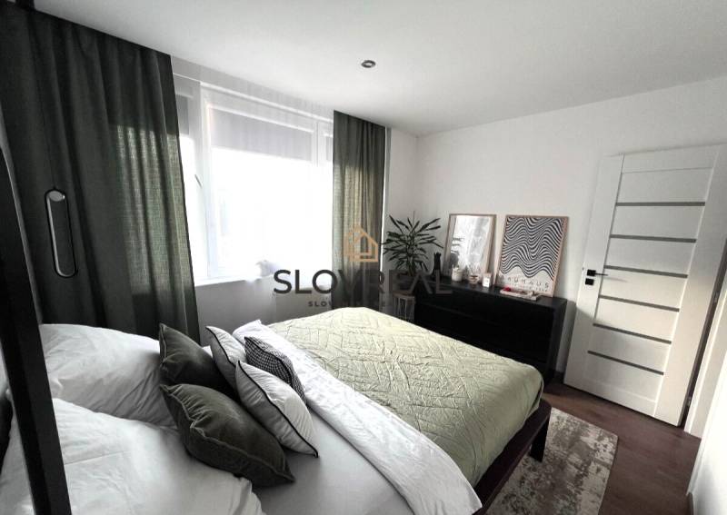 Bedroom in a 4-room apartment with stylish decor and furniture.
