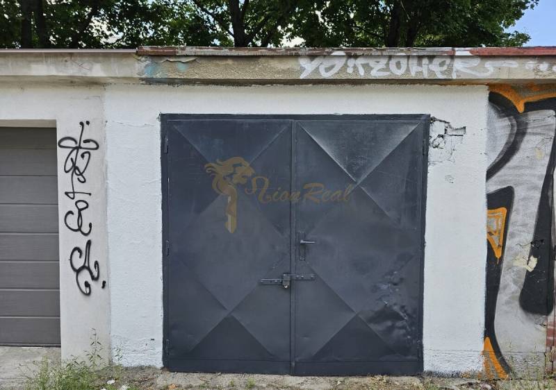 Garages on Kukučínova Street in Bratislava - Nové Mesto, with graffiti on the walls.