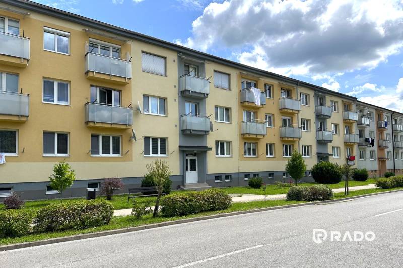 Apartment building on Obrancov Mieru, Púchov with green front gardens and balconies.