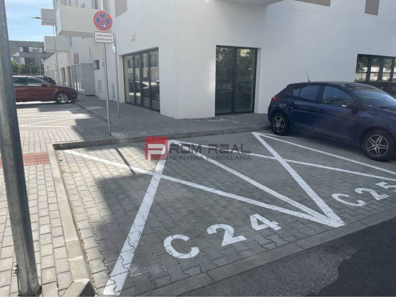 Parking space on Eduarda Wenzla Street in Bratislava III in front of commercial premises.
