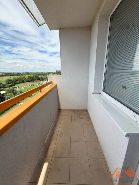The balcony of a 3-room apartment on Železiarenská Street in Galanta with a view of the countryside.