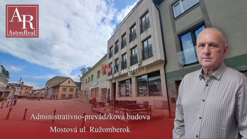 The building on Mostová Street in Ružomberok with a terrace and surrounding historical structures.