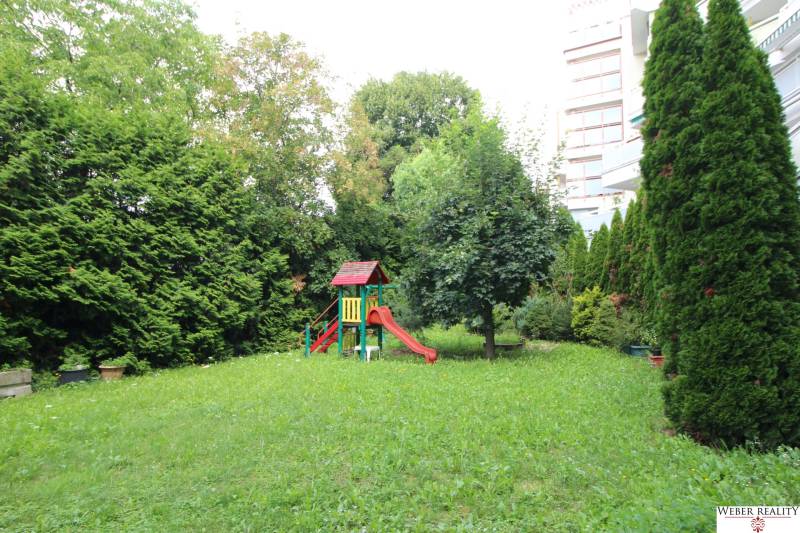 Garden with a children's playground, surrounded by greenery, Bratislava - Dúbravka, Žatevná, commercial premises.