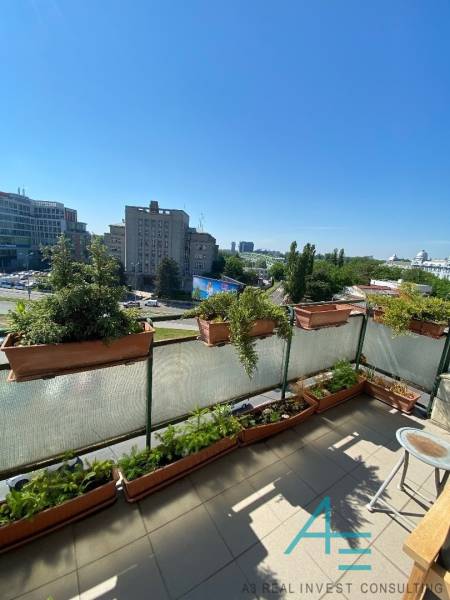 View from the balcony of a 4-room apartment on Dostojevského rad in Bratislava with flower pots.