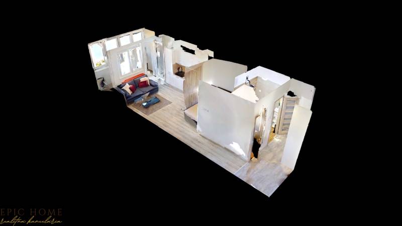 3D floor plan of a one-bedroom apartment with a living room and bedroom.