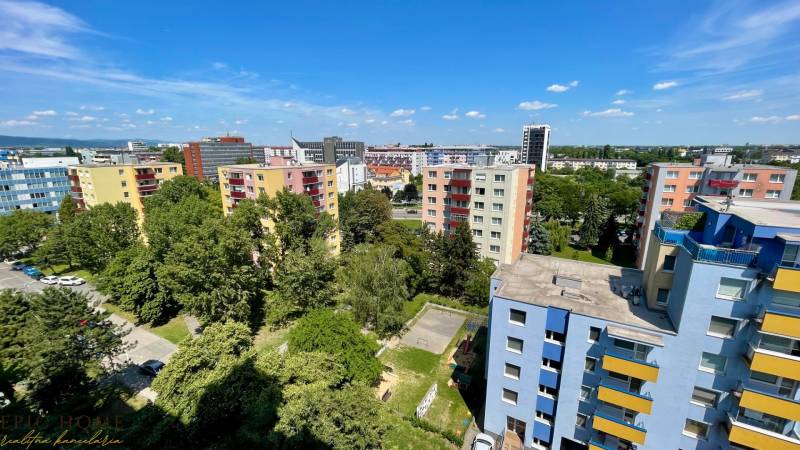 View of colorful apartment buildings and greenery on Rezedova Street in Bratislava - Ružinov.