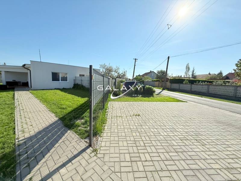 A family house in Košúty with a spacious yard and well-maintained lawn.