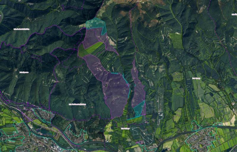 Aerial view of agricultural and forest lands around Sučany, showing different zones of use.
