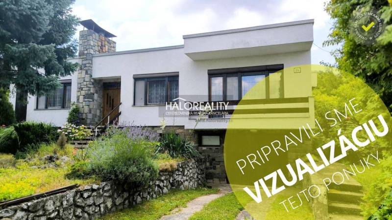 A family house in Plavecký Mikuláš surrounded by a well-maintained garden and flowers.