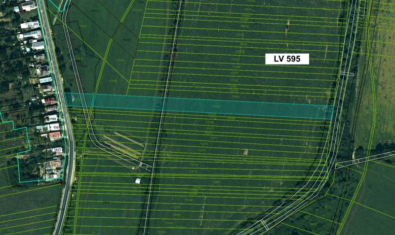 Aerial view of agricultural and forest lands in Topoľovka with parcel numbers.