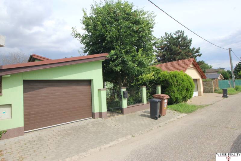 Nové Záhrady VII Street in Bratislava-Ružinov with a family house and garden.
