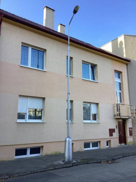 A family house on Kalinčiakova Street in Piešťany with a lamp on the sidewalk.