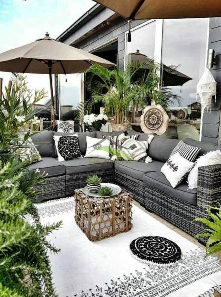The terrace of a family house in Tašula with garden furniture and plants.
