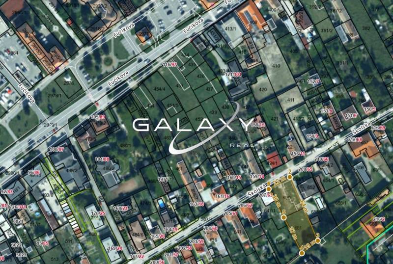 An aerial map shows Školská Street with a focus on residential plots.