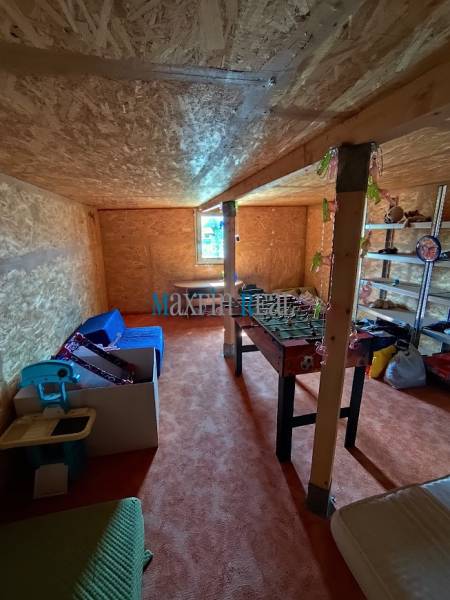 A room with seating and table football, suitable for Land - living.