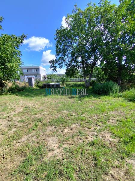 Residential plots surrounded by greenery in Jelšovce with proximity to family houses.