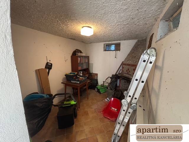 Storage room with various tools and a ladder, Land - housing.