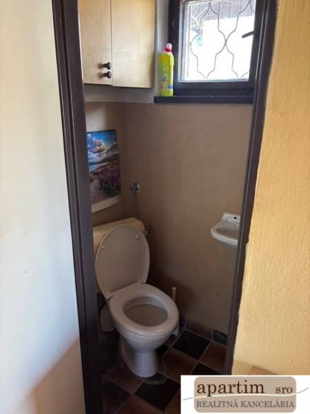 Toilet with sink in the interior near plots - housing.