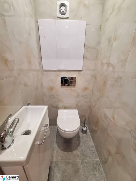 Bathroom in a 2-room apartment with a toilet and a sink.