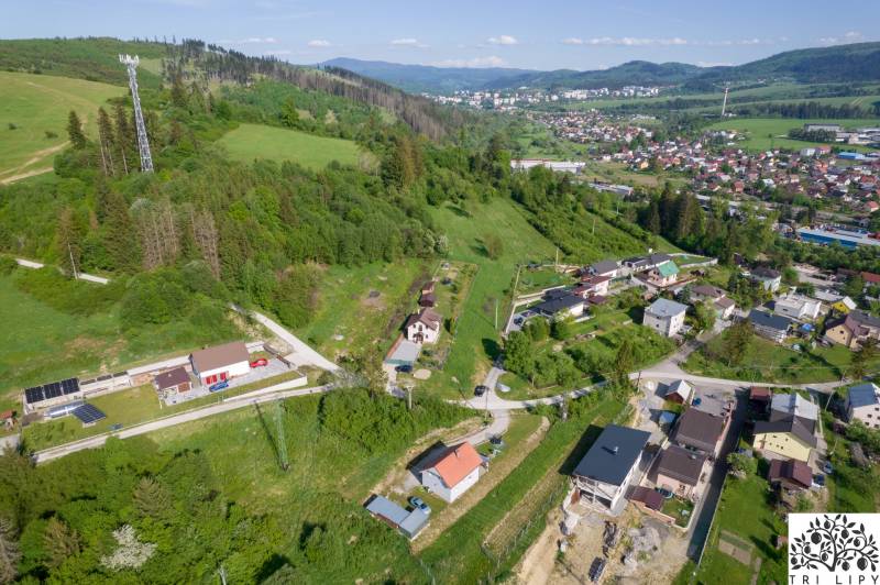 An aerial photograph shows extensive residential land in the village of Raková.