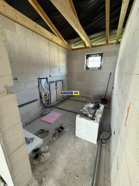 A construction room in a family house with unfinished interior design.