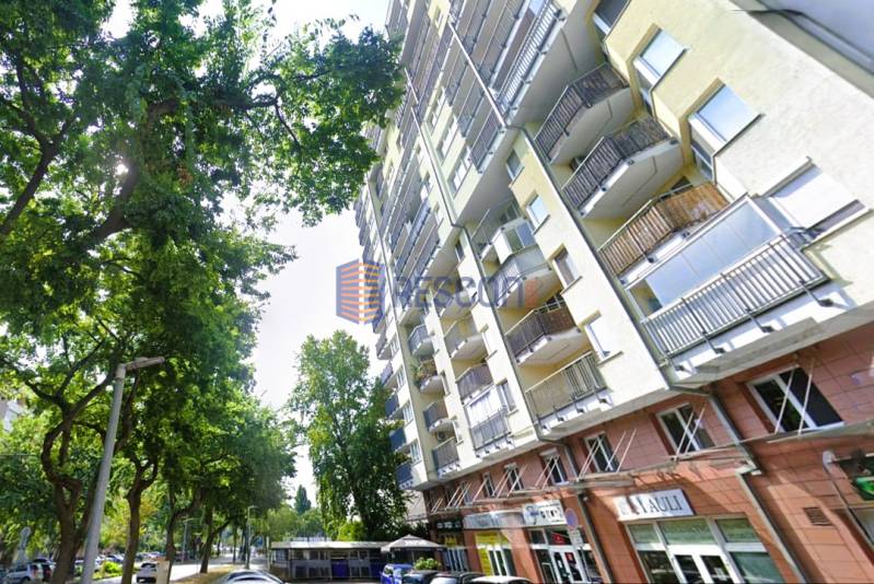 Apartment building with balconies on Jégého Street, Bratislava - Ružinov, surrounded by greenery.