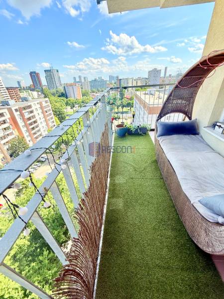 A balcony of a 2-room apartment with a view of the Bratislava skyline on Jégého Street.