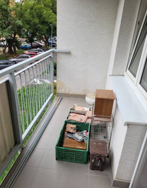 The balcony of a 3-room apartment with a view of the parking lot and Mesačná Street in Bratislava - Ružinov.