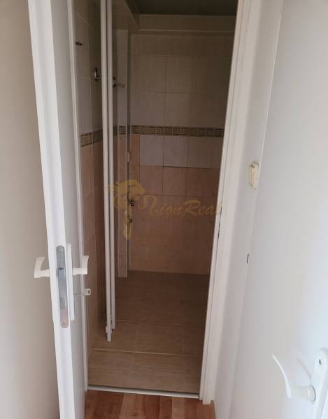 Bathroom with tiles and wall tiles in a 3-room apartment.