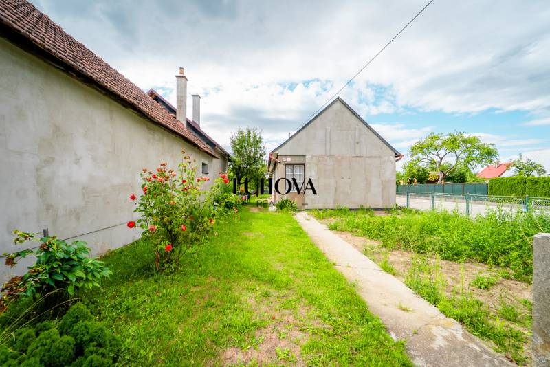 Family house on Pavla Koyša in Ladce with yards and flowers.
