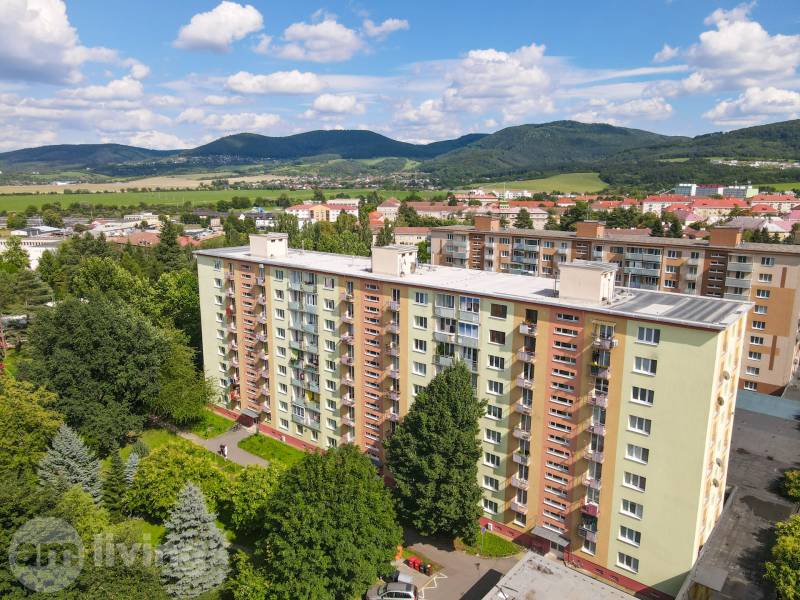 View of the apartment building with greenery in Nová Dubnica on SNP Street.