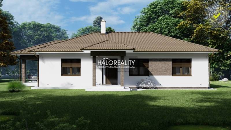 A family house with a brown roof and white facade in the residential plots in Udiča.