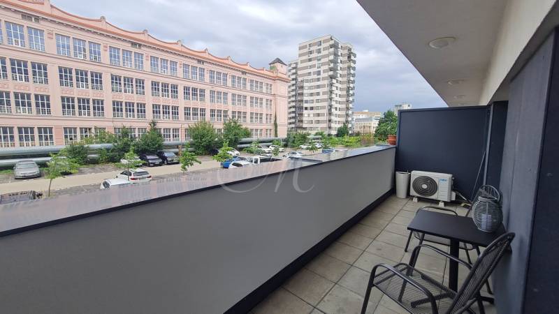 A balcony from a 2-room apartment on Miletičova, Bratislava - Ružinov, with a view of the parking lot.