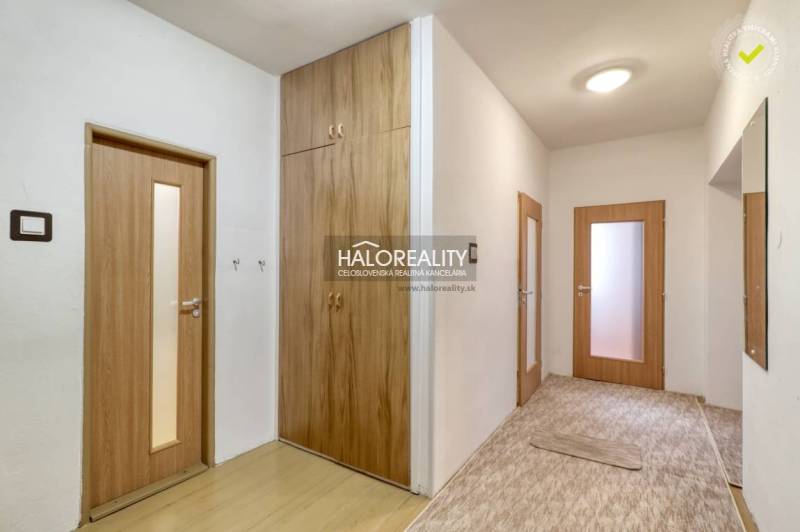 Interior of a 3-room apartment with wooden doors and built-in wardrobes.